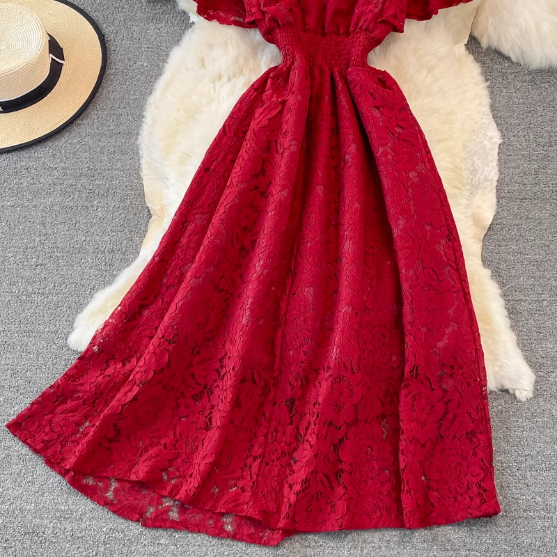 Full view of the red lace dress, showing the A-line silhouette and the detailed lace pattern.