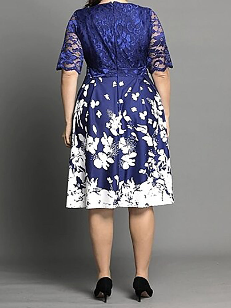 Rear view of plus size blue and white floral print fit and flare dress with lace top