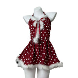 studio shot of a red and white polka dot halter dress with faux fur trim on a mannequin