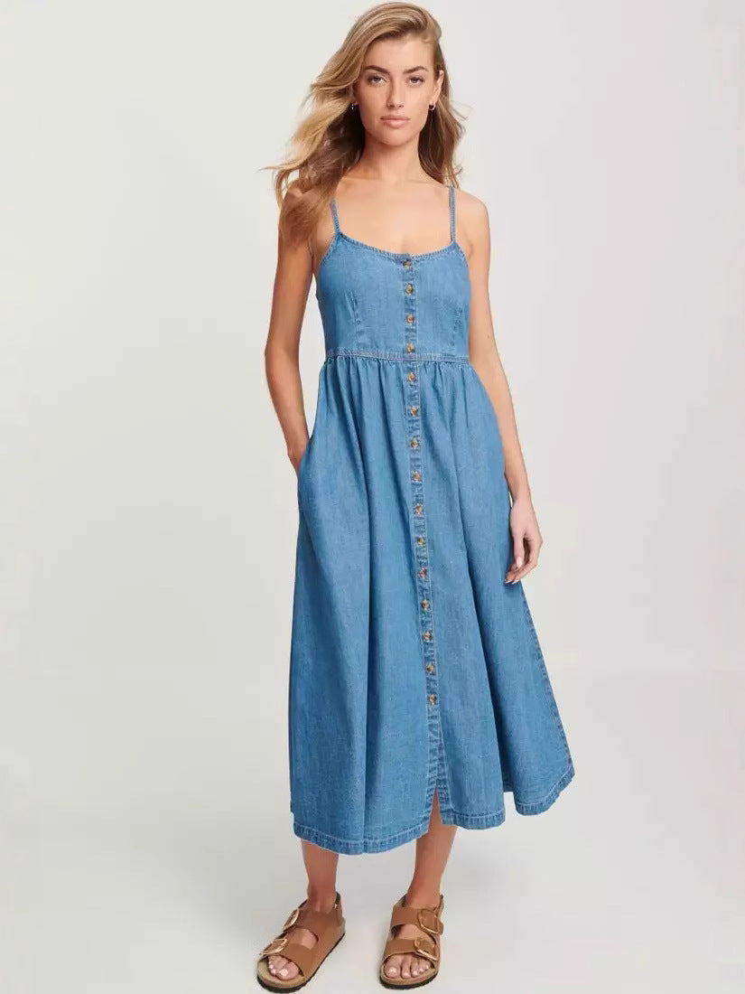 model wearing a blue denim midi dress with adjustable spaghetti straps and a button-down front