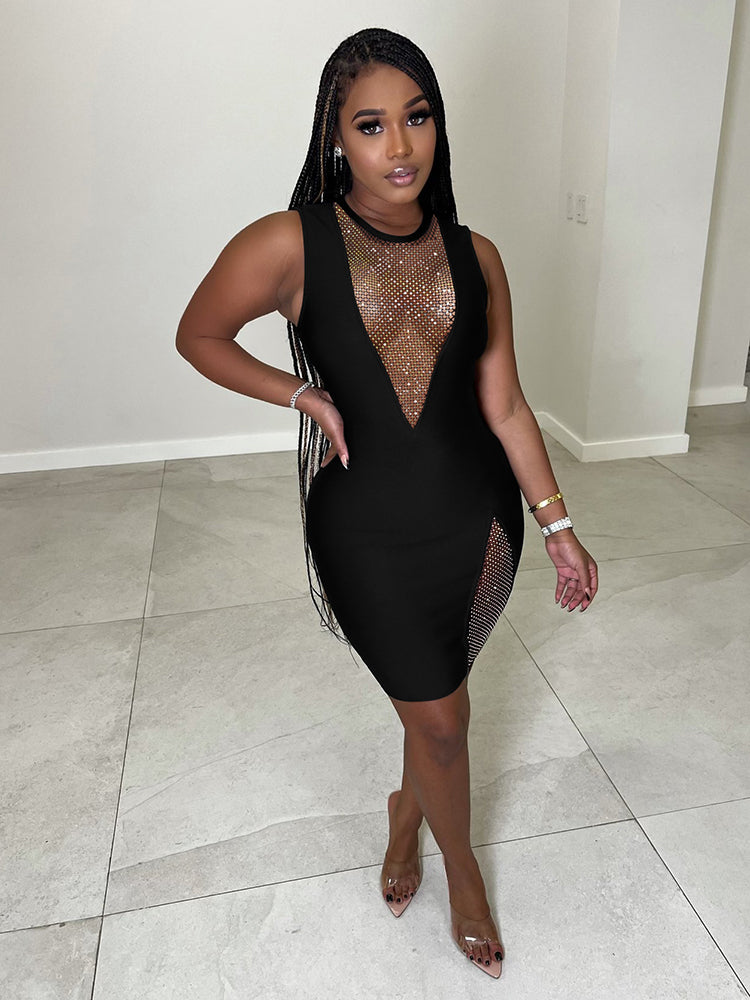 Woman posing in a black sleeveless bodycon mini dress with a plunging V-neckline and embellished details.