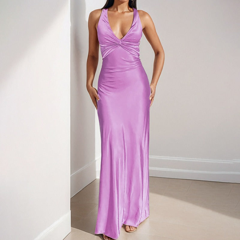 Lavender satin maxi dress with a twisted halter neckline and flowing skirt