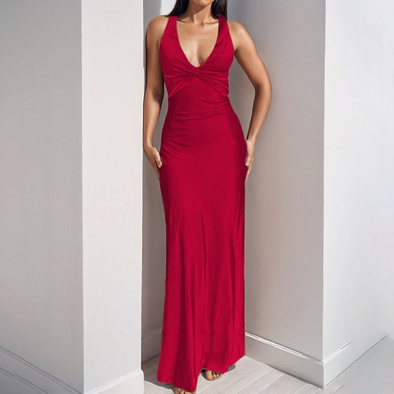 Red satin maxi dress with a twisted halter neckline and flowing skirt