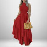 woman in red halter neck maxi dress with ruffled tiers and smocked bodice