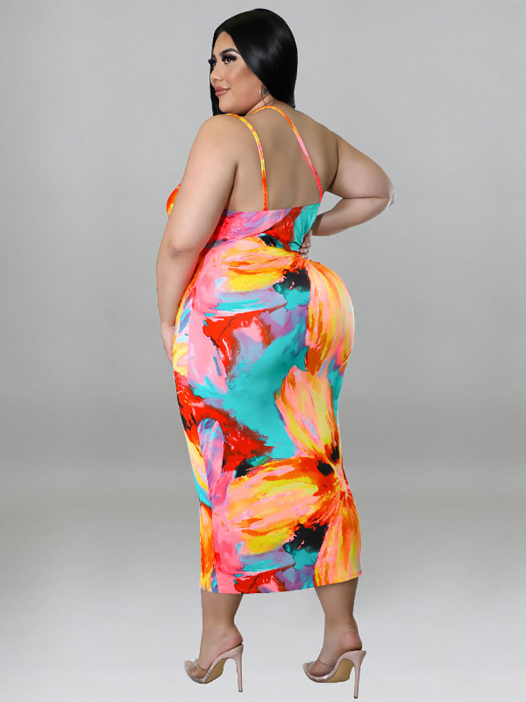 Plus-size woman wearing a colorful floral print halter neck bodycon midi dress with cut-out details and a tie waist, back view