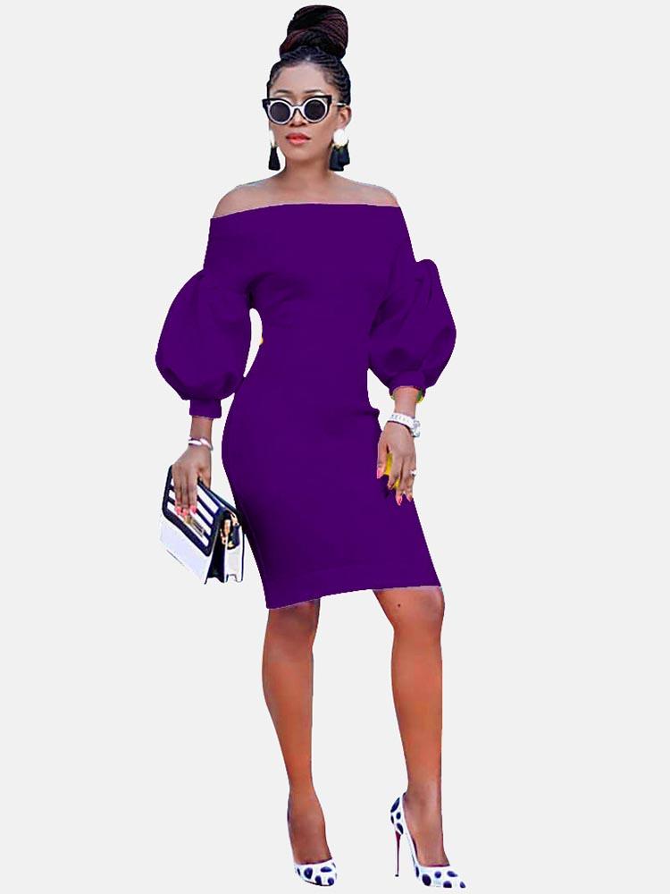 Woman wearing a purple off-the-shoulder dress with puff sleeves