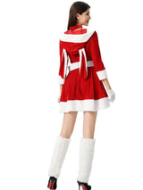 Rear view of a woman in a red velvet Christmas costume with a hooded capelet