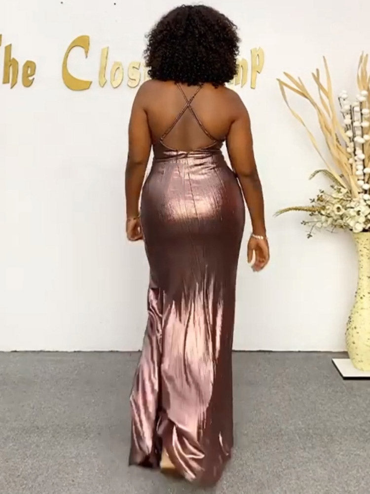 Back view of a woman in a metallic evening gown with a low back.