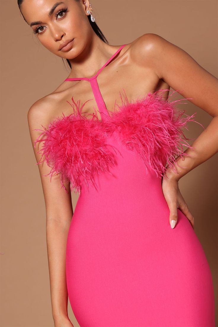 Detailed view of the feather trim and halter neckline on a hot pink bandage midi dress.