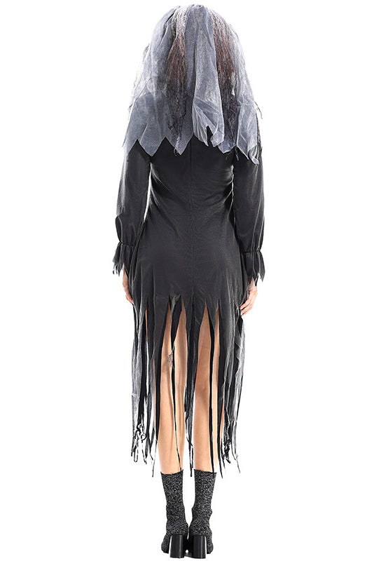 Back view of a woman in a dark, tattered Halloween costume with a veil, revealing the full length of the dress.