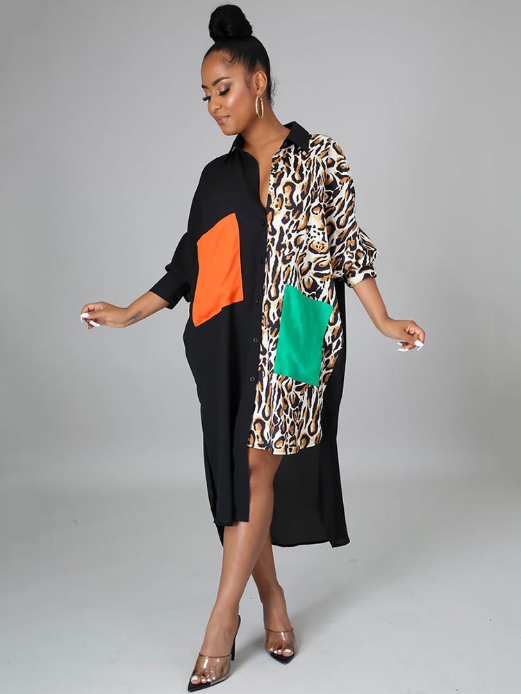 Full-length view of a woman in a black and leopard print color-blocked shirt dress with asymmetrical hem.