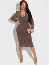 Woman wearing a bronze metallic knit V-neck long sleeve bodycon midi dress