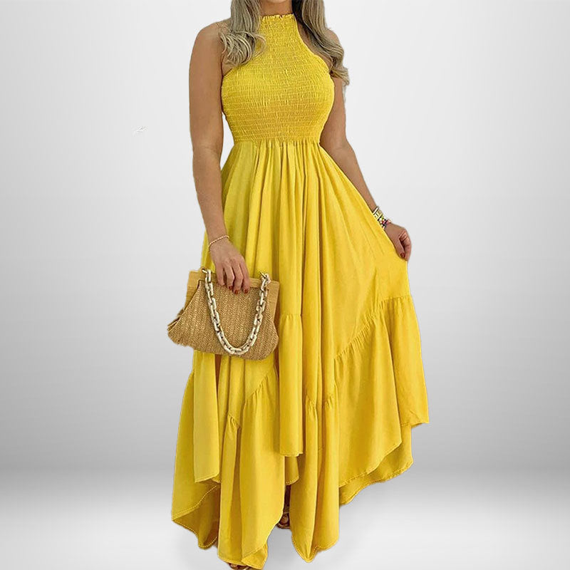 woman in yellow halter neck maxi dress with ruffled tiers and smocked bodice