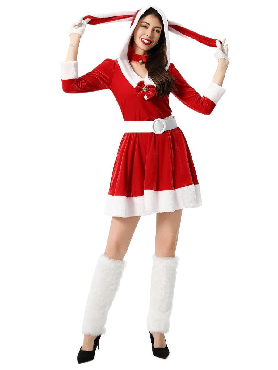 Woman wearing a red velvet Christmas costume with a hood and bunny ears