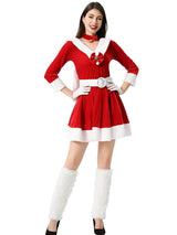 Woman posing in a red Christmas dress with a white belt and matching accessories