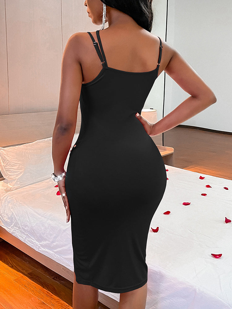 Back view of a woman in a black ribbed knit bodycon midi dress with spaghetti straps and a fitted silhouette.