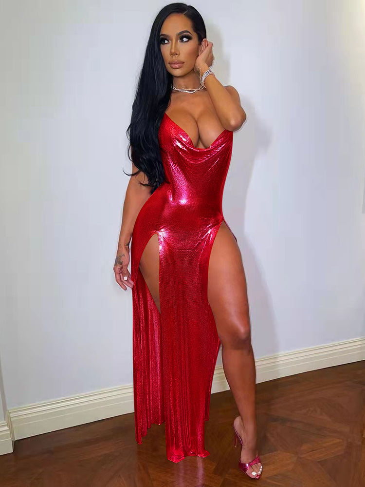 Woman wearing a red metallic mesh maxi dress with a cowl neck and high slit.