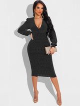 Woman wearing a black metallic knit V-neck long sleeve bodycon midi dress