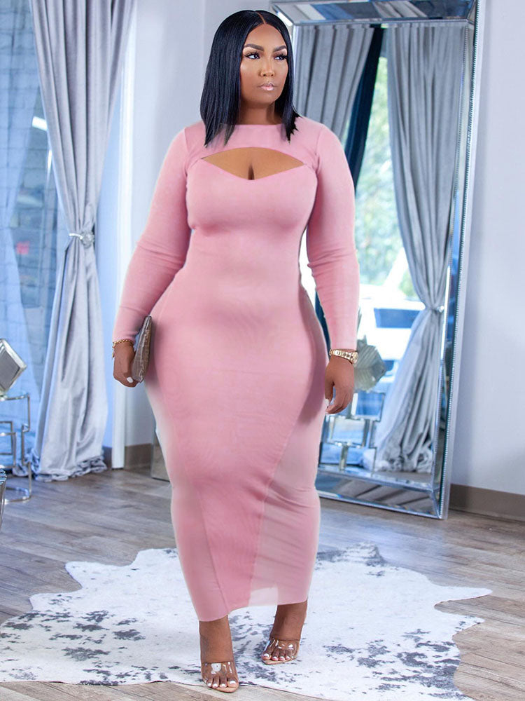 Woman wearing a long-sleeved pink midi dress with a keyhole neckline and sheer side panels.