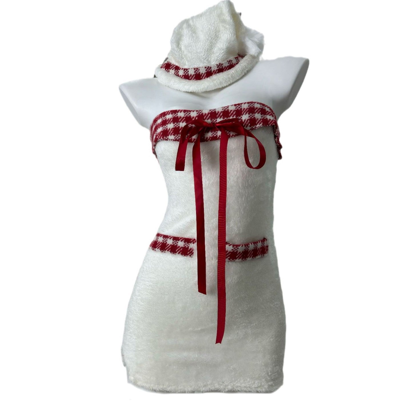 Front view of a white strapless dress with red plaid trim and red ribbon accents, displayed on a mannequin with a matching hat.