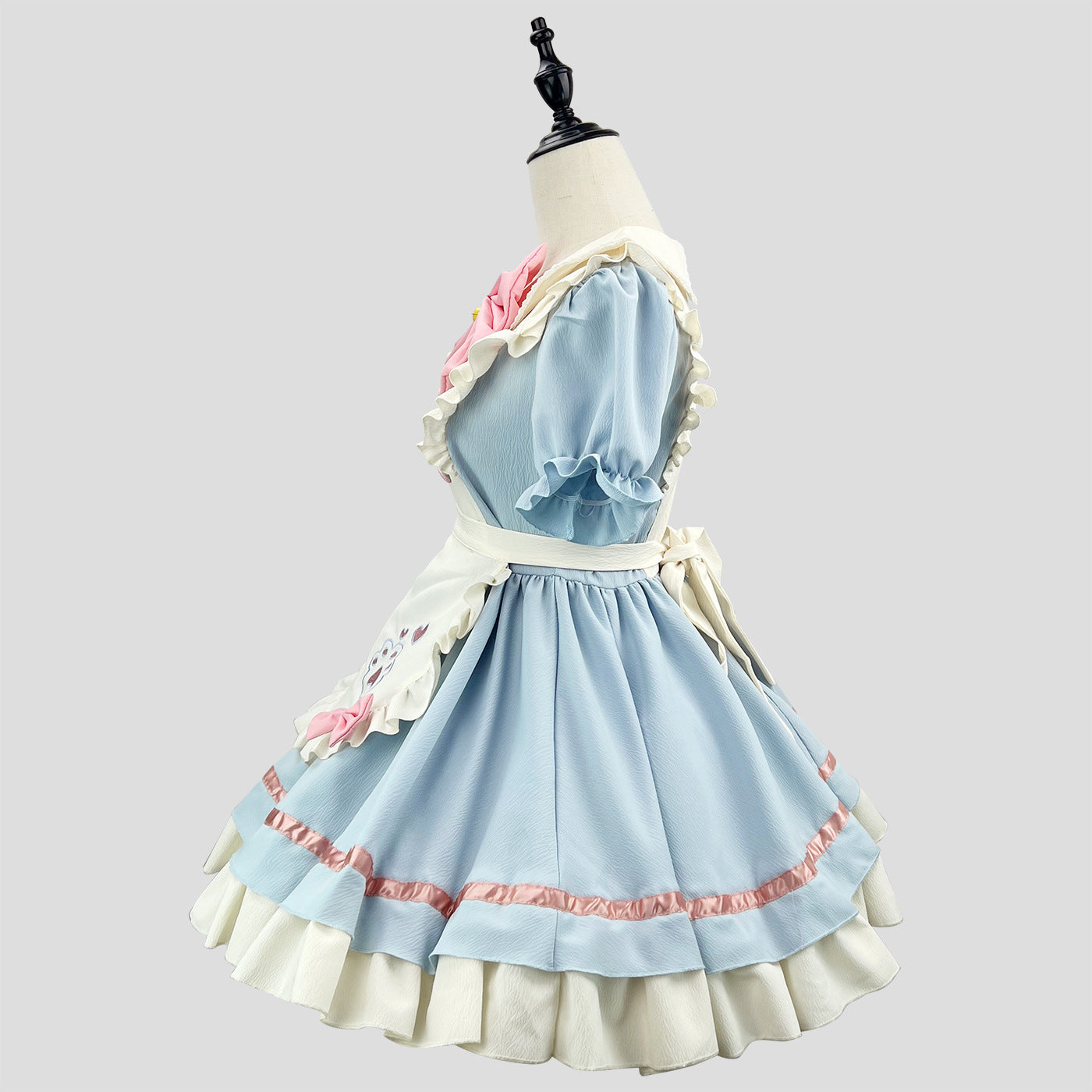 Side view of a blue and white maid costume with pink accents, displayed on a mannequin.