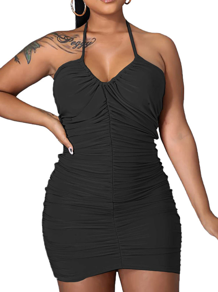 Woman wearing a black ruched halter dress, close-up front view.