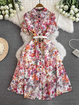 A floral print midi dress with a collared neckline and short sleeves, belted at the waist.