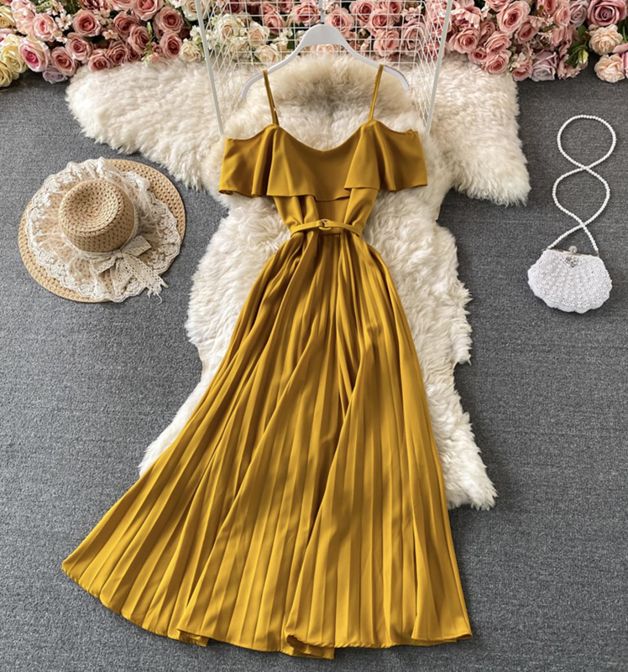 Yellow off-the-shoulder pleated dress with spaghetti straps and belt