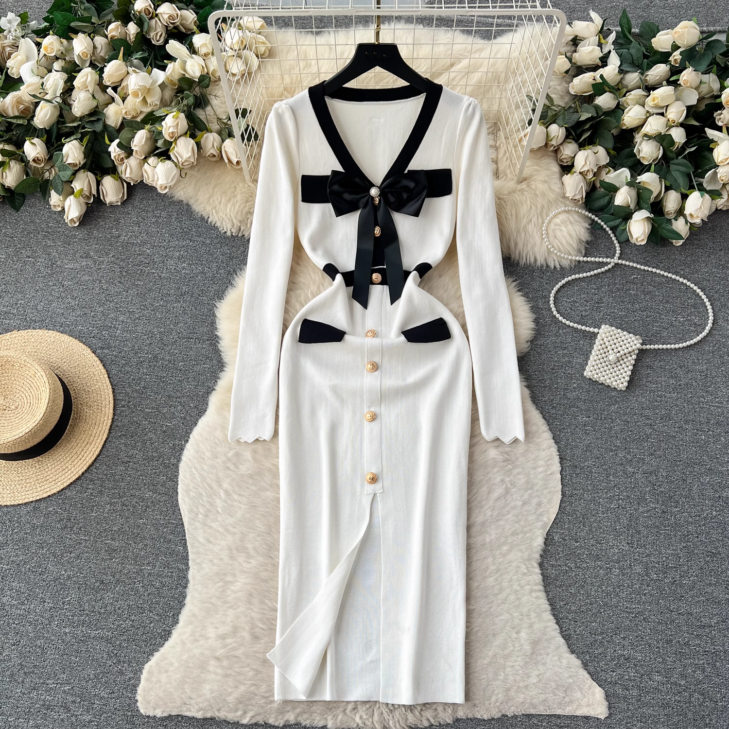 White knit dress with black trim and bow detail
