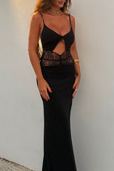 Front view of a woman wearing a black floor-length gown with cut-out detail