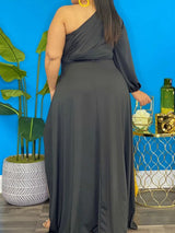 woman wearing a black one-shoulder high-low maxi dress, back view
