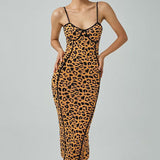 woman wearing a leopard print bodycon midi dress with thin straps