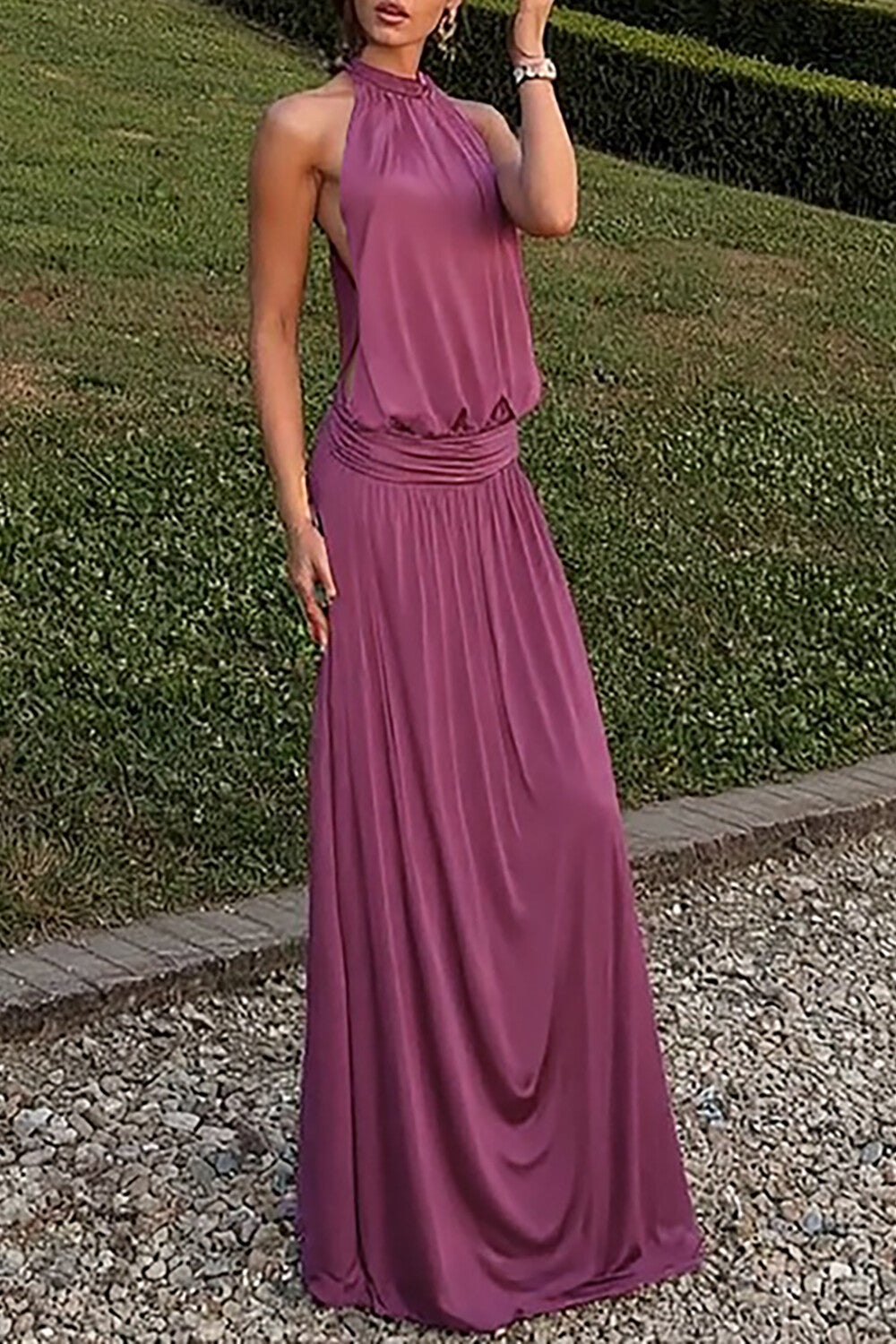 woman wearing a plum halter neck maxi dress outdoors