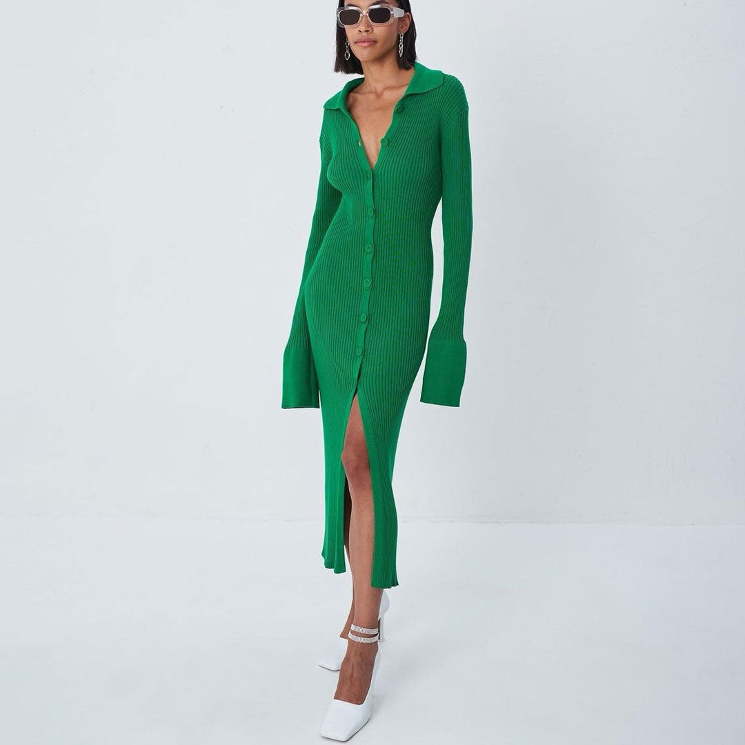 Woman wearing a green ribbed knit midi dress with a collared neckline, button-down front, and high slit, paired with white heels.