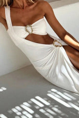 Close-up of the white one-shoulder maxi dress showcasing the cut-out details and ruched fabric.