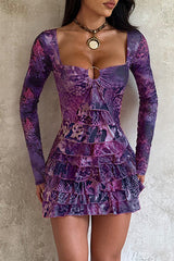 woman wearing a purple long-sleeved mini dress with a square neckline and ruffled hem