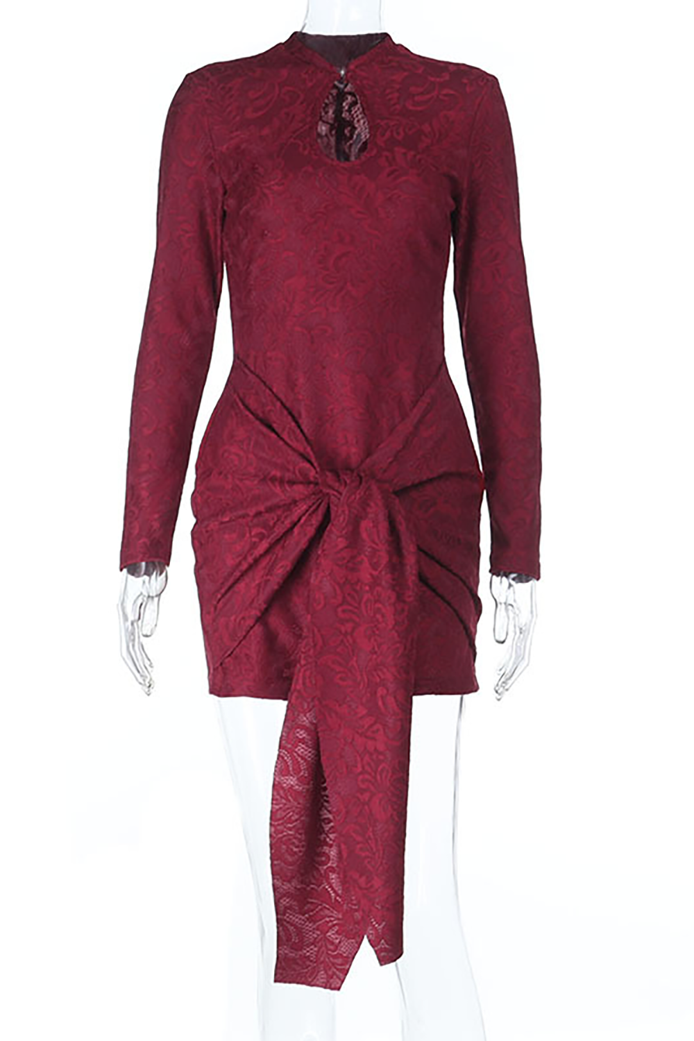 Model wearing a maroon lace mini dress with a keyhole neckline and long sleeves, posing with hands on hips.
