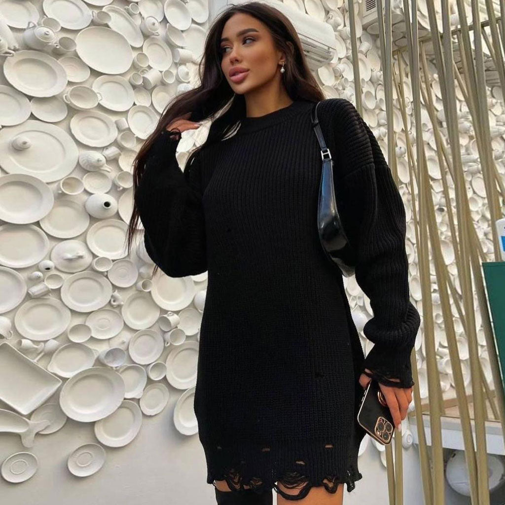 woman wearing a black distressed knit sweater dress