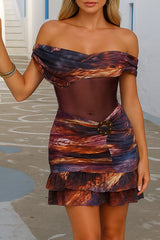 Close-up of a woman wearing an off-the-shoulder mini dress with a vibrant print.