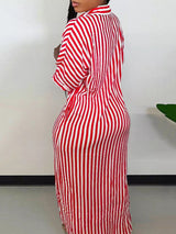 Back view of a woman in a red and white striped maxi dress.