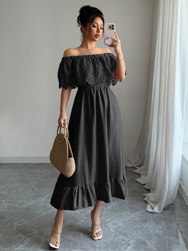 Woman taking a mirror selfie wearing a black off-the-shoulder maxi dress with lace bodice and ruffled hem, holding a straw bag