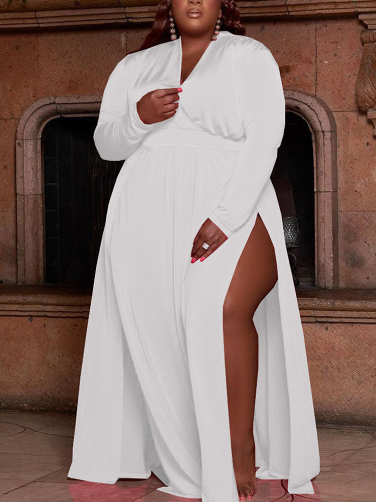 woman wearing a long white maxi dress with a high slit and long sleeves