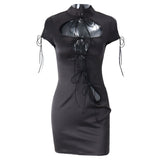 Black short-sleeve bodycon dress with a high neckline, cut-out details, and tie closures, displayed on a mannequin.