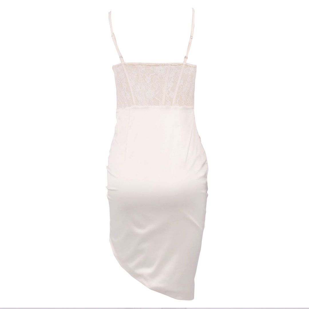 back view of a white ruched satin dress with a lace bodice and asymmetrical hem