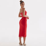 Back view of woman in red satin sheath dress with lace trim