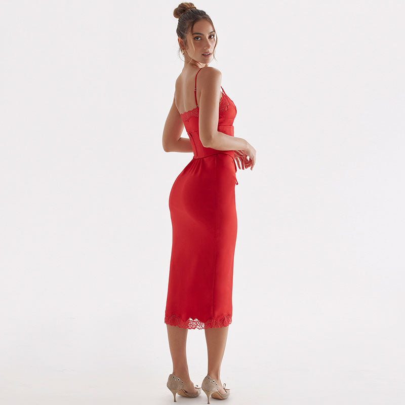 Back view of woman in red satin sheath dress with lace trim
