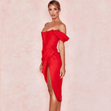 Woman in a red off-the-shoulder satin dress with a corset bodice and high slit, side view.
