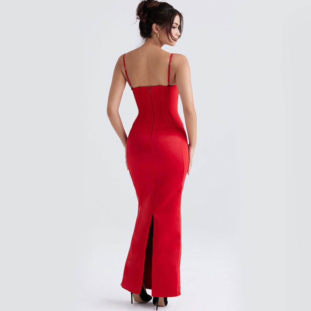Back view of a woman in a long red satin dress with a corset bodice and a back zipper.