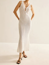 woman wearing white crochet knit maxi dress with black heels