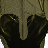 Close-up of the neckline and bodice of an olive green velvet and mesh dress